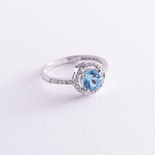 Золотое кольцо с голубым топазом и фианитам - Оникс