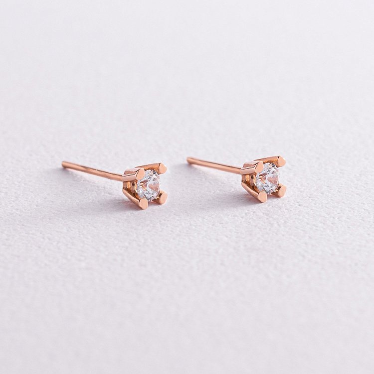 Золотые серьги-пусеты с фианитами с05308 от ювелирного магазина Оникс