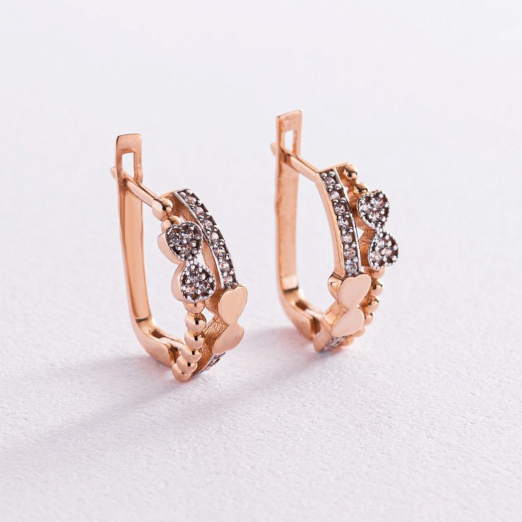 Золотые серьги "Бантики" с фианитами с04910 от ювелирного магазина Оникс