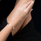 Жесткий браслет "Love" в желтом золоте (0.4 см) б02245 от ювелирного магазина Оникс - 1