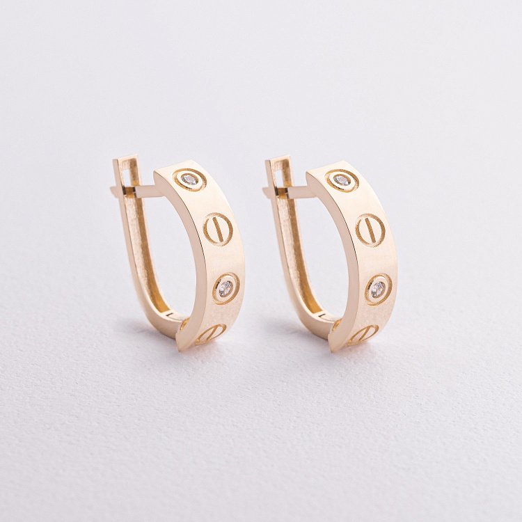 Сережки "Love" з фіанітами (жовте золото) с09317 від ювелірного магазину Онікс