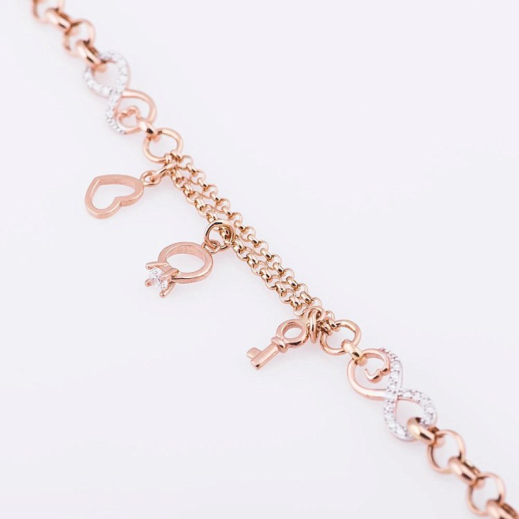 Жіночий золотий браслет з сердечком, колечком і ключиком б02798 від ювелірного магазину Онікс - 2