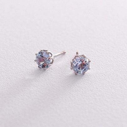 Золоті сережки-пусети з блакитним топазом с06403