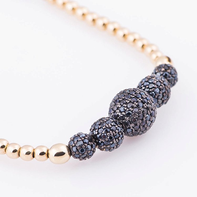 Золотий браслет "Кульки" з фіанітами б02689 від ювелірного магазину Онікс