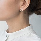 Срібні сережки-пусети "Кругообіг" з перлами 122593 от ювелирного магазина Оникс