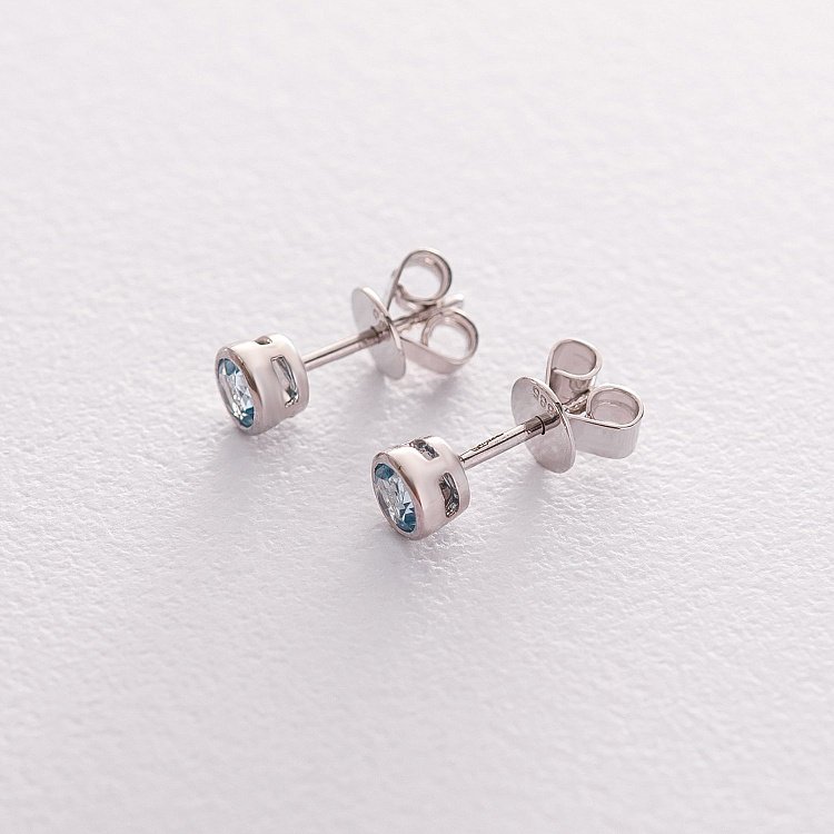 Золоті сережки-пусети з топазом блакитним сб0294gl від ювелірного магазину Онікс - 1