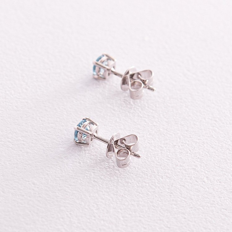 Золоті сережки - пусети з блакитними топазами сб0120gl від ювелірного магазину Онікс - 4