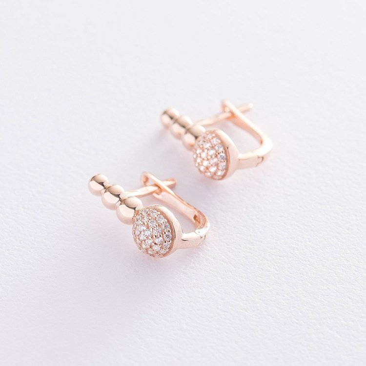 Золоті сережки з фіанітами с06775 від ювелірного магазину Онікс