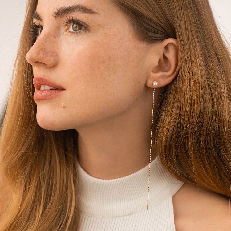 Сережки - протяжки з перлами (червоне золото) с09072 від ювелірного магазину Онікс