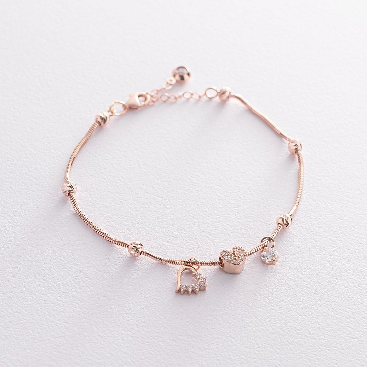 Золотой браслет "Сердечки" с фианитами б04688 от ювелирного магазина Оникс