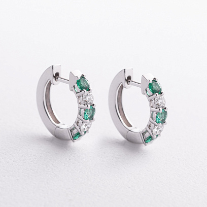 Серьги - кольца в белом золоте (бриллианты, изумруды) сб0729ri