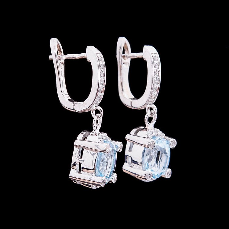 Срібні сережки з блакитним топазом 121439 від ювелірного магазину Онікс