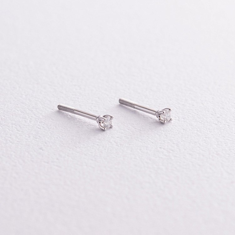 Золоті сережки - пусети з діамантами 335401121 від ювелірного магазину Онікс