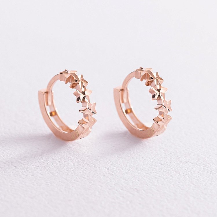 Золотые серьги - кольца "Звездочки" с07793 от ювелирного магазина Оникс