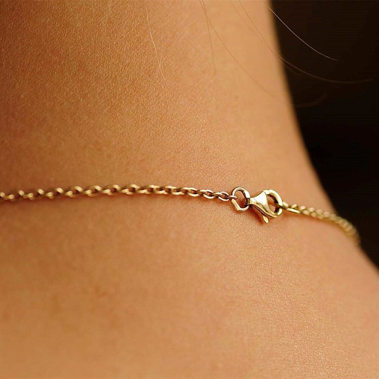 Золоте жіноче кольє "Конюшина" з оніксом і перламутром кол00581 від ювелірного магазину Онікс - 1