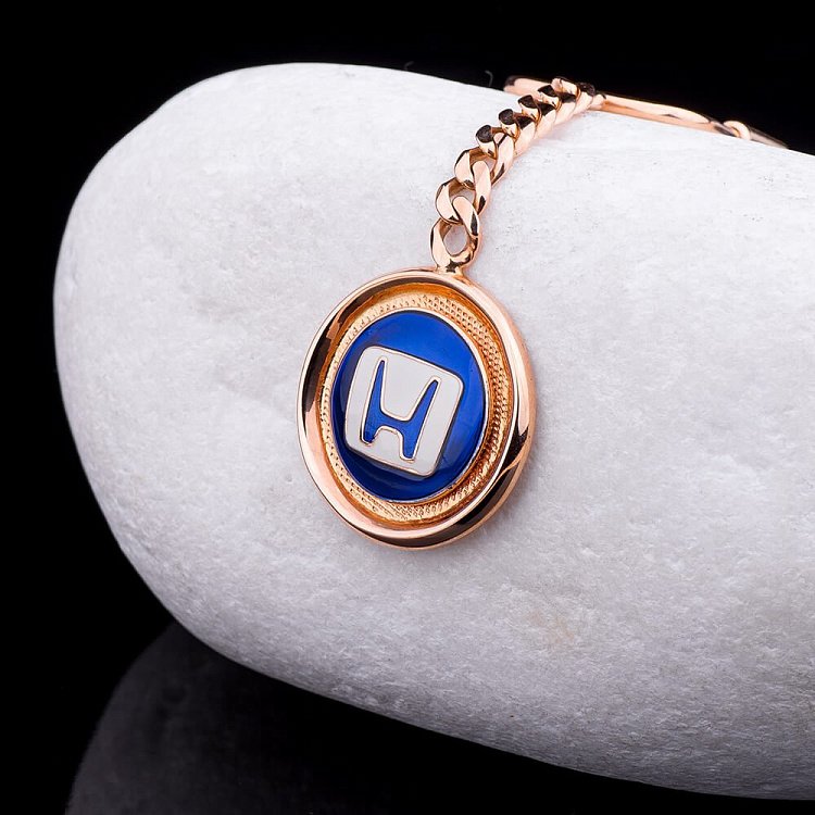Золотий брелок "Honda-Хонда" (емаль) бр00001х Золотий брелок "Honda-Хонда" (емаль) бр00001х від ювелірного магазину Онікс
