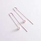 Золотые серьги - протяжки с жемчугом 580035 от ювелирного магазина Оникс