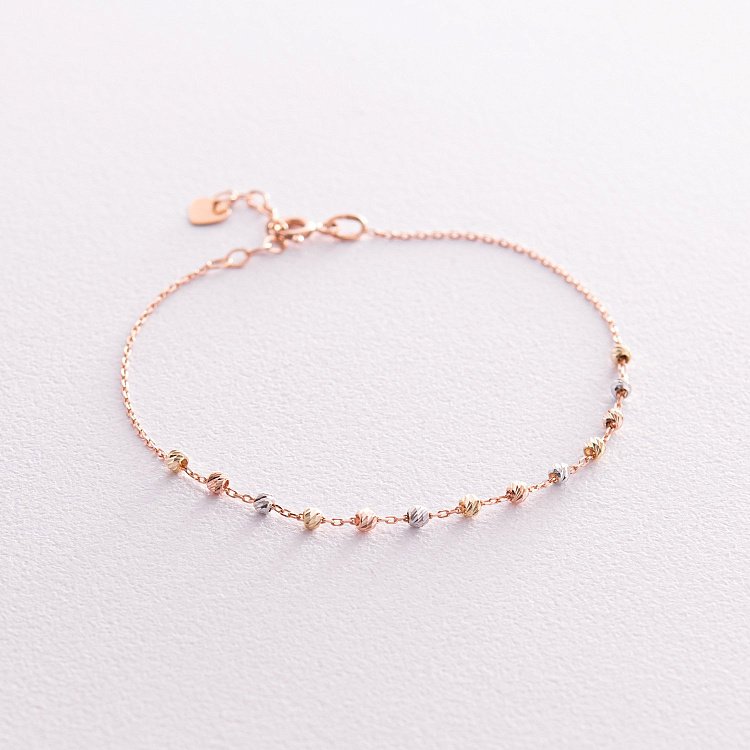 Браслет "Кульки" у трьох кольорах золота б05167 від ювелірного магазину Онікс