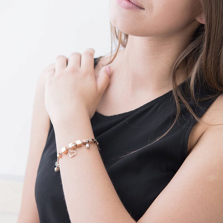 Ексклюзивний золотий браслет з серцями б02219 від ювелірного магазину Онікс