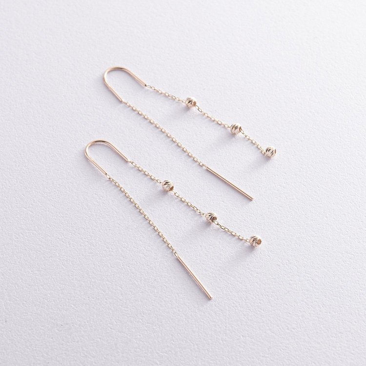 Висячі сережки з кульками у жовтому золоті (протяжки) с08336 від ювелірного магазину Онікс