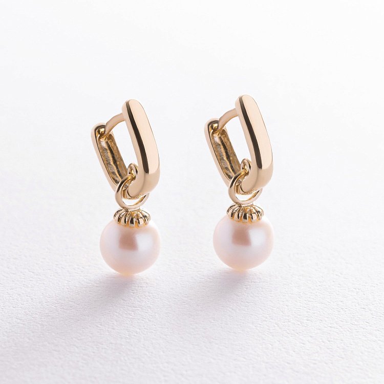 Золоті сережки з перлами с06940 від ювелірного магазину Онікс