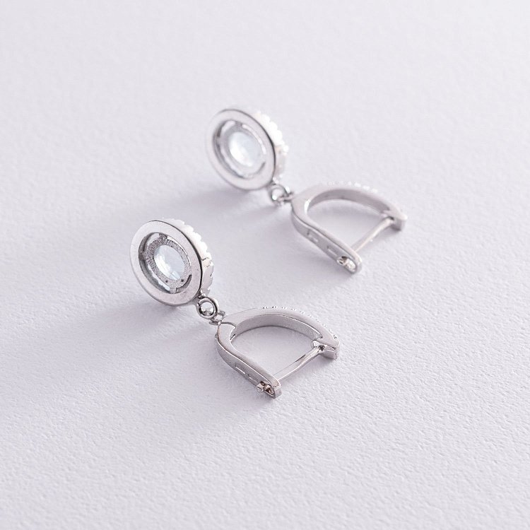 Срібні сережки з блакитними топазами і фіанітами 121361 від ювелірного магазину Онікс - 2