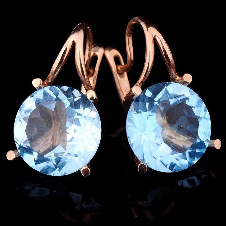 Золотые серьги с голубым топазом с00911 от ювелирного магазина Оникс