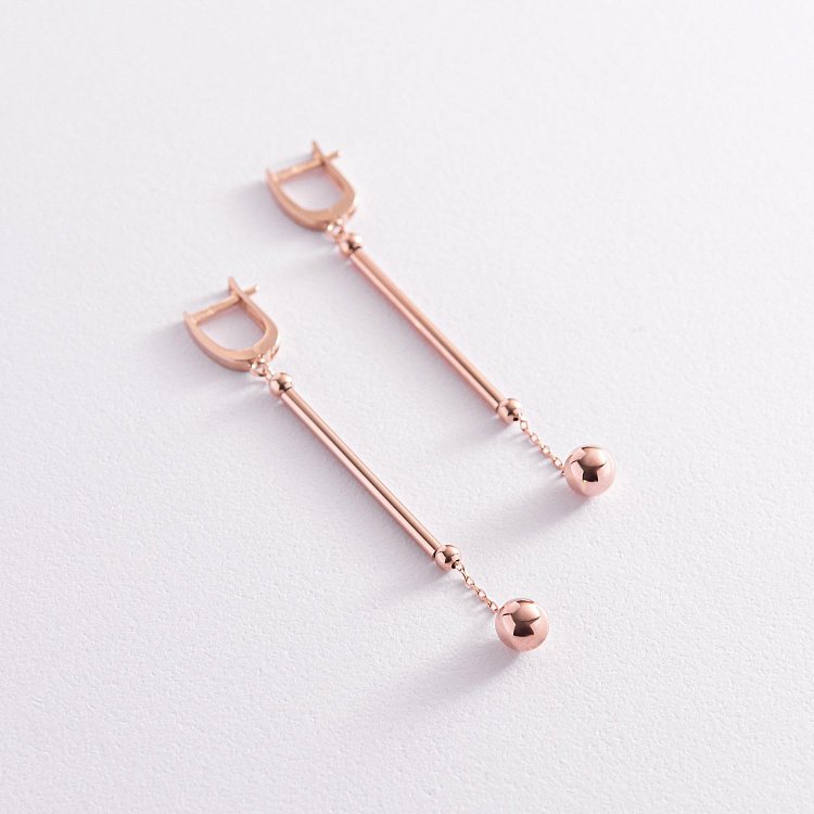 Золотые серьги "Шарики" на цепочке с07828 от ювелирного магазина Оникс - 1