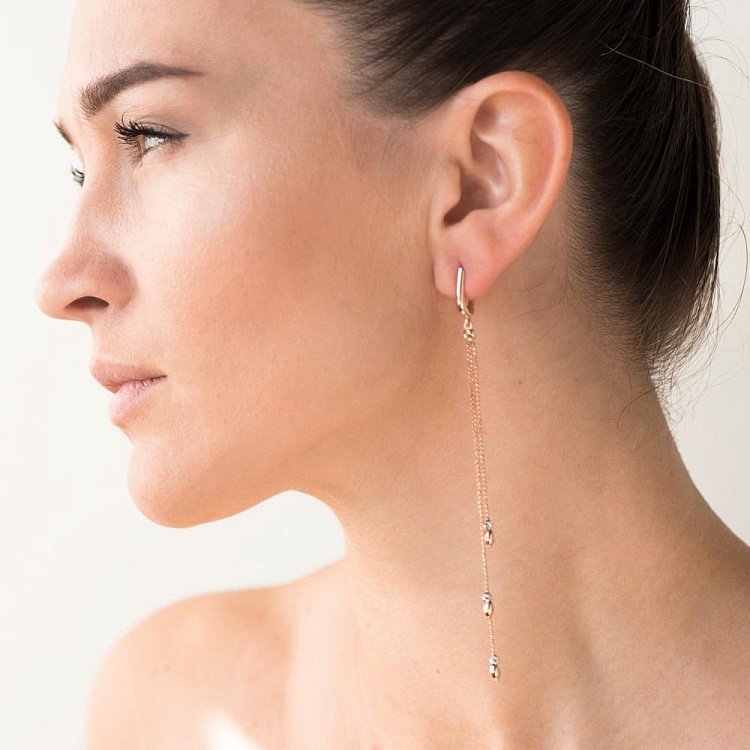 Золоті сережки на ланцюжку с05604 від ювелірного магазину Онікс