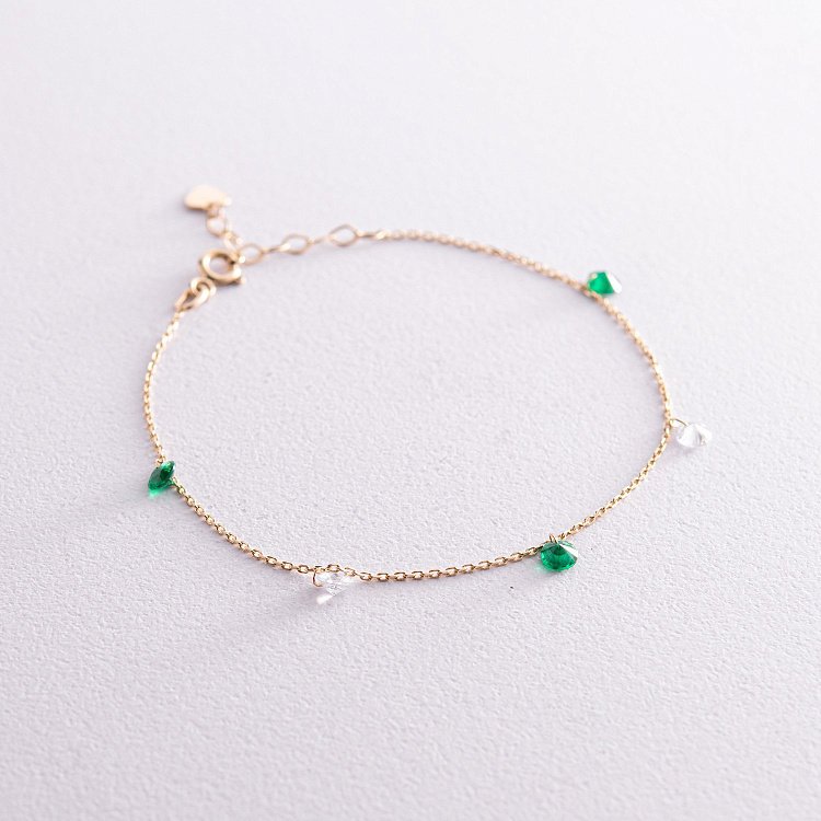 Браслет у жовтому золоті (зелені та білі фіаніти) б05138 від ювелірного магазину Онікс