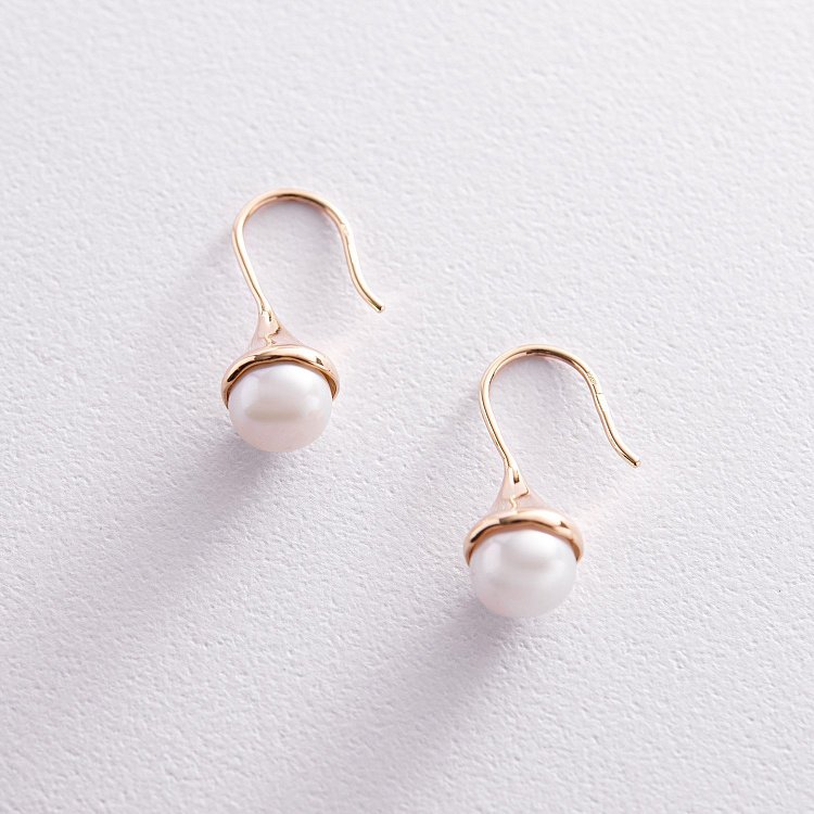 Золоті сережки - петельки з перлами с07865 від ювелірного магазину Онікс