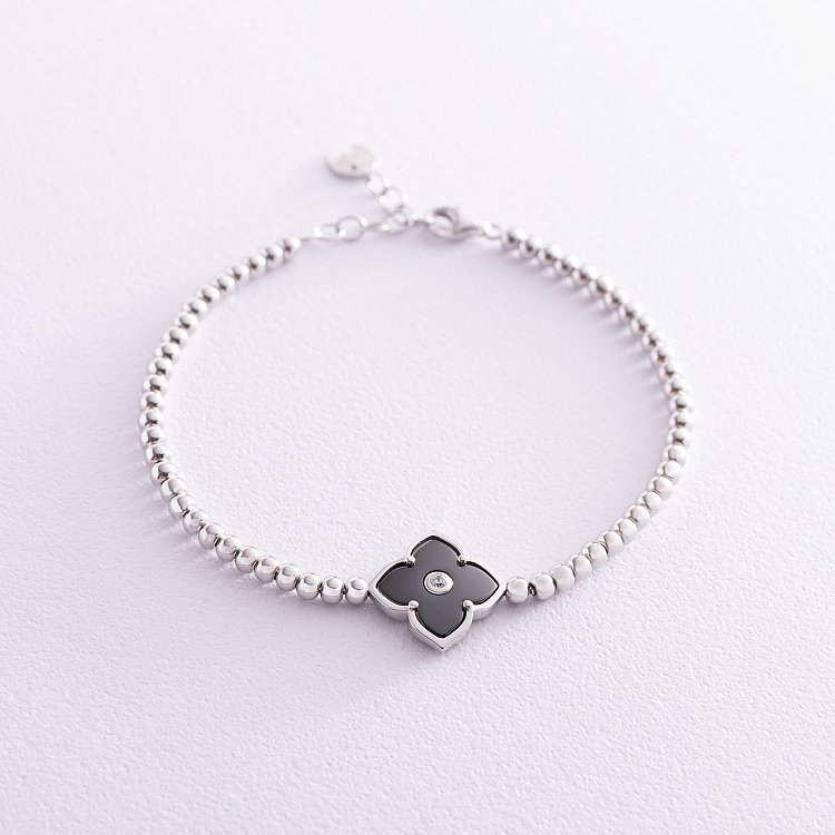 Срібний браслет "Конюшина" (фіаніт, кераміка) 141491 від ювелірного магазину Онікс