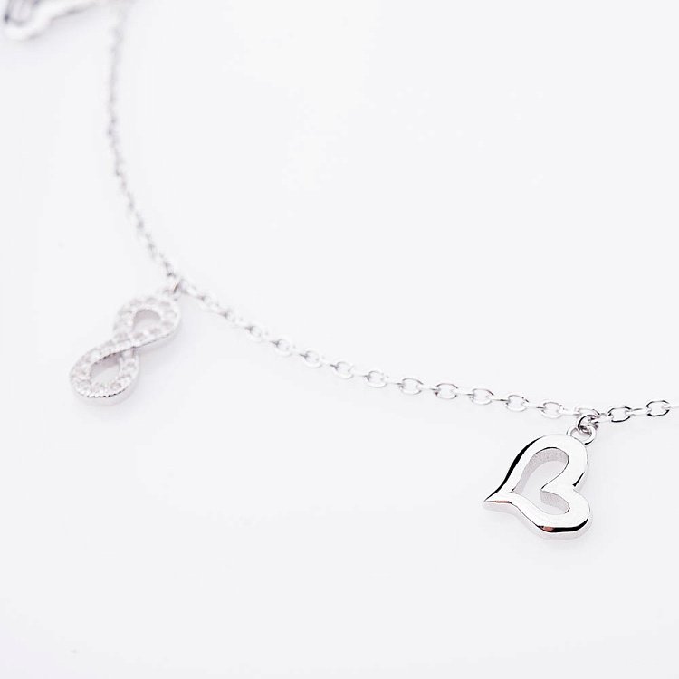 Срібний браслет на ногу "Нескінченність і серця" з фіанітами 14912 від ювелірного магазину Онікс - 7