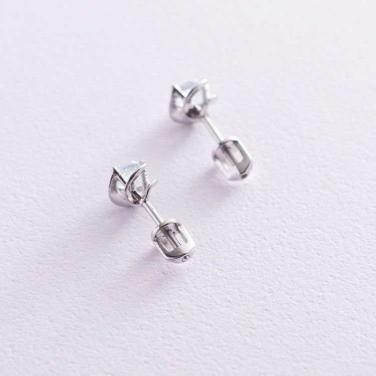 Золоті сережки-пусети з блакитним топазом с02404 від ювелірного магазину Онікс - 2