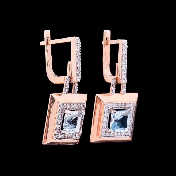 Золоті сережки з блакитним топазом і фіанітами с03164 від ювелірного магазину Онікс