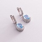 Серебряные серьги с голубыми топазами и фианитами 121334 от ювелирного магазина Оникс