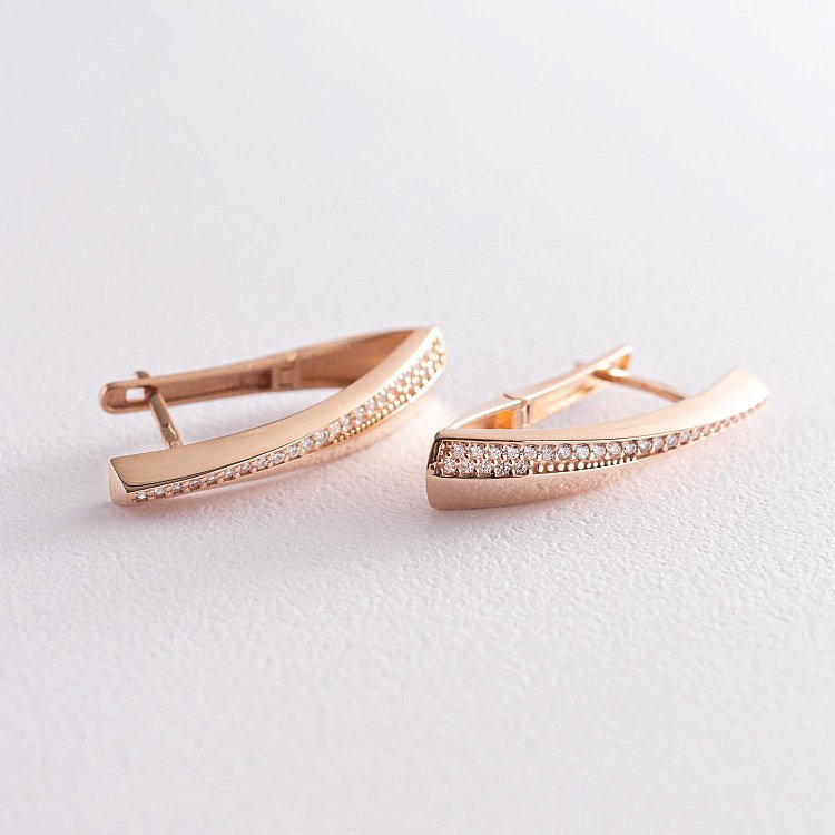 Золоті сережки на англійській застібці (фіаніт) с07029 від ювелірного магазину Онікс