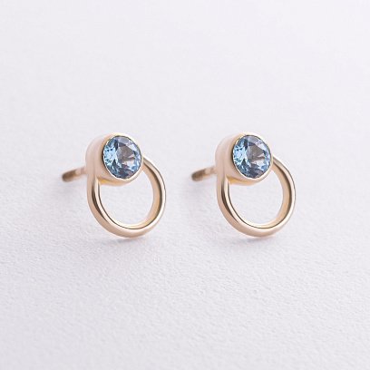 Сережки - пусети "Ейпріл" з блакитними топазами (жовте золото) с08773