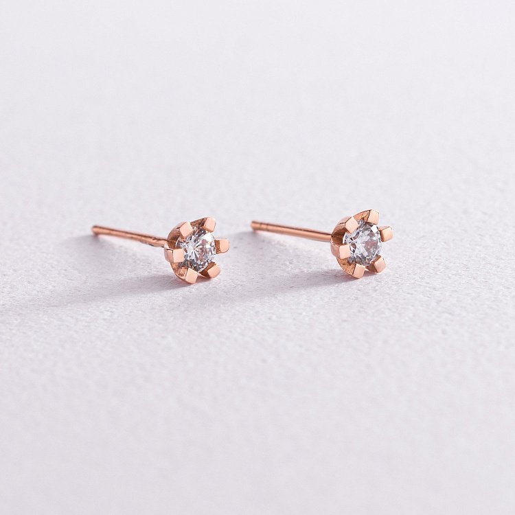 Золоті сережки-пусети з фіанітами с05815 від ювелірного магазину Онікс