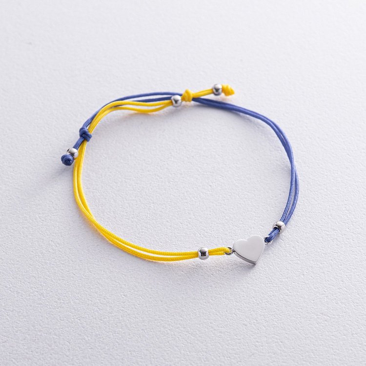 Браслет "Українське серце" у білому золоті (синя та жовта нитка) б05276 від ювелірного магазину Онікс