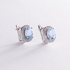 Серебряные серьги с голубыми топазами и фианитами 121389 от ювелирного магазина Оникс