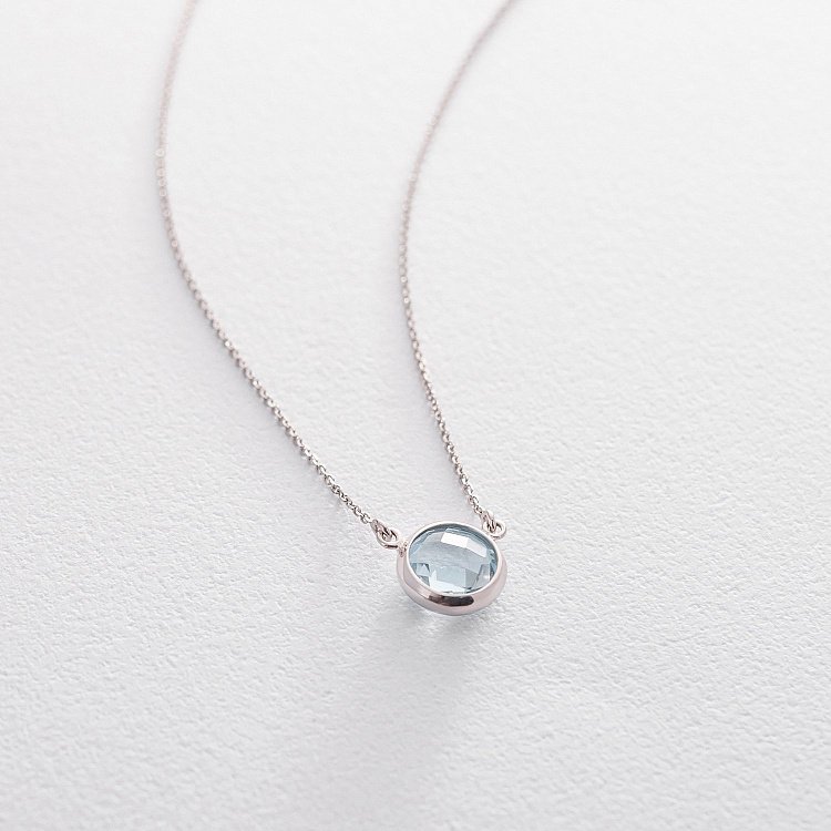 Золоте кольє з блакитним топазом кол01325 від ювелірного магазину Онікс