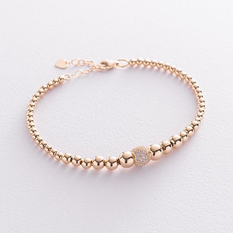 Браслет "Кульки" в жовтому золоті (фіаніти) б04652 від ювелірного магазину Онікс