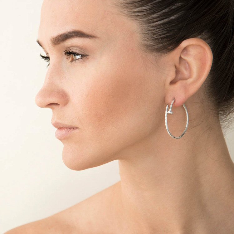 Срібні сережки "Цвяшки" з фіанітами 121749 від ювелірного магазину Онікс