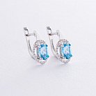 Золоті сережки з блакитним топазом і діамантами C01083E от ювелирного магазина Оникс