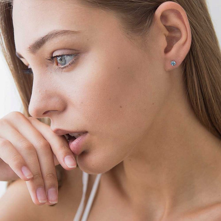 Золоті сережки-пусети з блакитним топазом СТД2-154 від ювелірного магазину Онікс - 3