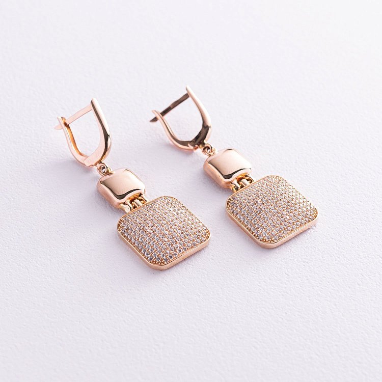 Золоті сережки з фіанітами с06144 від ювелірного магазину Онікс