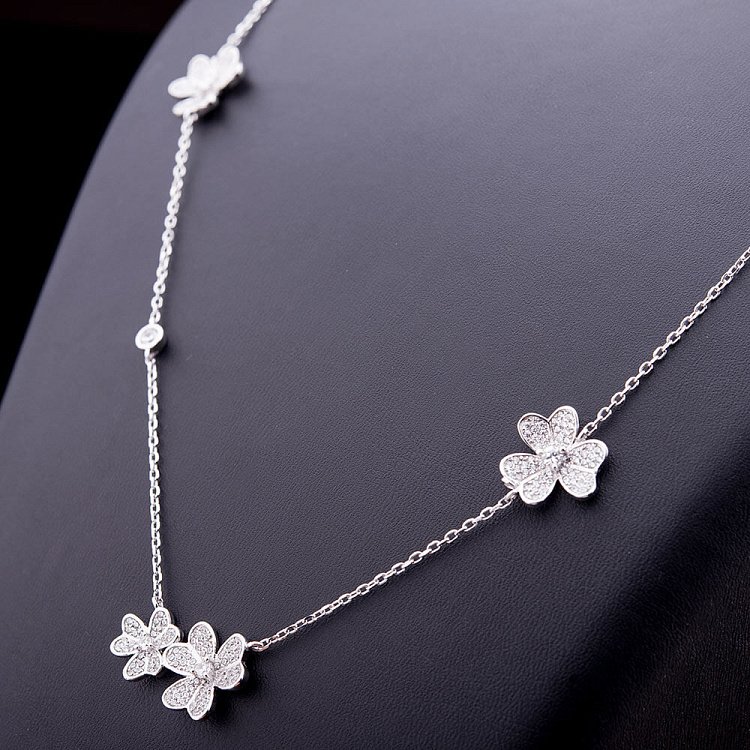 Срібне кольє "Квіточки" з фіанітами 15138 від ювелірного магазину Онікс