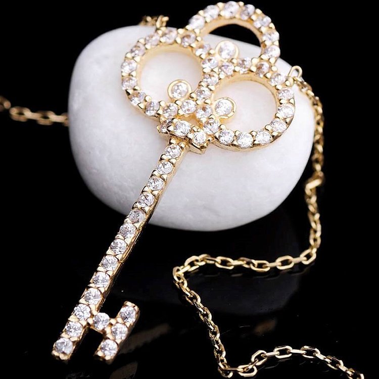 Золотое колье "Ключик" с фианитами кол00587 от ювелирного магазина Оникс