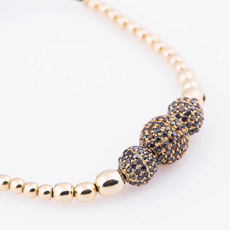 Золотий браслет "Кульки" з фіанітами б02693 від ювелірного магазину Онікс